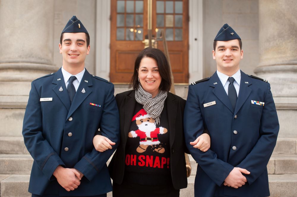 Stephanie and her two sons standing in front of the NH Stathouse. Her sons both proudly serve in the United States Space Force. 